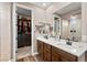 Elegant bathroom with double sink vanity, modern fixtures, and glass shower at 12430 Foxtail Run Ave, Las Vegas, NV 89138