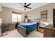 Bedroom featuring a ceiling fan, natural light, and stylish furniture at 12430 Foxtail Run Ave, Las Vegas, NV 89138