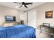 Bedroom featuring a ceiling fan, natural light, and stylish furniture at 12430 Foxtail Run Ave, Las Vegas, NV 89138