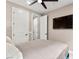 Another bedroom view featuring television and plenty of storage at 12430 Foxtail Run Ave, Las Vegas, NV 89138