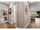 Hallway featuring hardwood floors and neutral paint leading to a bedroom and living area at 12430 Foxtail Run Ave, Las Vegas, NV 89138
