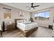 Bedroom featuring a ceiling fan, natural light, and stylish furniture at 12430 Foxtail Run Ave, Las Vegas, NV 89138