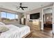Bedroom featuring a ceiling fan, natural light, and stylish furniture at 12430 Foxtail Run Ave, Las Vegas, NV 89138