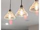 Close-up view of stylish pendant lights illuminating the kitchen island at 12430 Foxtail Run Ave, Las Vegas, NV 89138
