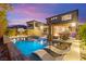 An inviting pool boasts a basketball hoop and sun loungers, offers a space for both active play and relaxation at 12430 Foxtail Run Ave, Las Vegas, NV 89138