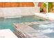 Backyard swimming pool with spa featuring waterfall at 12430 Foxtail Run Ave, Las Vegas, NV 89138