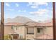 Scenic view of mountains and neighboring houses through a window at 12430 Foxtail Run Ave, Las Vegas, NV 89138