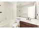 Bathroom with a soaking tub and a dark wood vanity at 1252 Casa Palermo Cir, Henderson, NV 89011