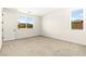 Bright bedroom with neutral carpet and two windows offering views of the outdoors at 1252 Casa Palermo Cir, Henderson, NV 89011