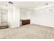 Bright bonus room with plush carpeting, a stylish wet bar, and abundant natural light from multiple windows at 1252 Casa Palermo Cir, Henderson, NV 89011