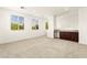 Spacious bonus room features large windows, neutral carpeting, and a convenient wet bar for entertaining at 1252 Casa Palermo Cir, Henderson, NV 89011