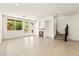 Bright open floor plan with a cozy fireplace and a door leading to the backyard at 1252 Casa Palermo Cir, Henderson, NV 89011