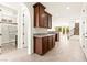 Open-concept space with kitchen bar, staircase, and bathroom, perfect for modern living at 1252 Casa Palermo Cir, Henderson, NV 89011