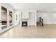 Open living room features a fireplace, tile flooring and staircase at 1252 Casa Palermo Cir, Henderson, NV 89011