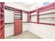Spacious walk-in closet with custom shelving, drawers, and ample hanging space for organized storage at 1252 Casa Palermo Cir, Henderson, NV 89011