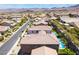 Upscale neighborhood with well-maintained homes with tile roofs and backyard swimming pools in a desert community at 133 Clouded Ave, Henderson, NV 89002