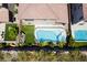 Aerial view of private backyard with pool, patio, and lush landscaping at 133 Clouded Ave, Henderson, NV 89002