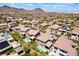 Expansive aerial view showcasing a desert community, highlighting the neighborhood and mountain views at 133 Clouded Ave, Henderson, NV 89002