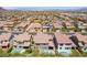 Upscale neighborhood with well-maintained homes with tile roofs and backyard swimming pools in a desert community at 133 Clouded Ave, Henderson, NV 89002