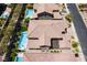 Aerial view showcasing pool, patio, landscaped yard, and architectural roof design at 133 Clouded Ave, Henderson, NV 89002