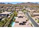 Upscale neighborhood with well-maintained homes with tile roofs and backyard swimming pools in a desert community at 133 Clouded Ave, Henderson, NV 89002
