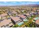 Upscale neighborhood with well-maintained homes with tile roofs and backyard swimming pools in a desert community at 133 Clouded Ave, Henderson, NV 89002