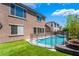 Backyard view of a private pool, -safe fencing, and low-maintenance artificial turf at 133 Clouded Ave, Henderson, NV 89002