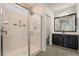 Bathroom with black cabinets, quartz countertop, and a glass shower at 133 Clouded Ave, Henderson, NV 89002