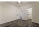 Bedroom with wood-look floors, white walls and trim, and a walk-in closet at 133 Clouded Ave, Henderson, NV 89002