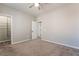 Bedroom featuring plush carpet, a ceiling fan, and a walk-in closet for optimal storage at 133 Clouded Ave, Henderson, NV 89002