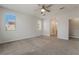 Bedroom with light colored walls, ceiling fan and ensuite bathroom at 133 Clouded Ave, Henderson, NV 89002