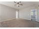 Spacious bedroom featuring a ceiling fan, neutral color palette, and plush carpeting at 133 Clouded Ave, Henderson, NV 89002