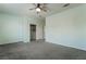Large bedroom featuring a ceiling fan, plush carpeting, and a sizable walk-in closet at 133 Clouded Ave, Henderson, NV 89002