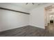 This bedroom has hardwood floors and a large beam running across the top of the wall at 133 Clouded Ave, Henderson, NV 89002