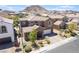 Charming two-story home with a tile roof, desert landscaping, and a two-car garage in a Gathering-friendly neighborhood at 133 Clouded Ave, Henderson, NV 89002