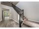 Spacious foyer showcases wood-look floors, staircase, and an inviting open layout at 133 Clouded Ave, Henderson, NV 89002