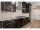 Gourmet kitchen boasting stainless steel appliances, granite countertops, and custom cabinetry at 133 Clouded Ave, Henderson, NV 89002