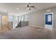 Open loft area with natural light, plush carpet, and access to other rooms at 133 Clouded Ave, Henderson, NV 89002