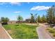 Community park offers a playground, lush grass, and a walking path for neighborhood enjoyment at 133 Clouded Ave, Henderson, NV 89002