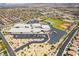 Aerial view of a community school with sports fields, parking, and recreational areas in a suburban neighborhood at 133 Clouded Ave, Henderson, NV 89002