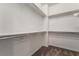Spacious walk-in closet featuring built-in shelving and plush carpeting at 133 Clouded Ave, Henderson, NV 89002