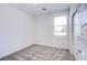 Cozy bedroom with neutral carpet, large window, and closet with sliding doors at 145 Aqua Commons Ln, Henderson, NV 89015