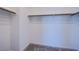 This walk-in closet is carpeted and ready for organization with multiple rods at 145 Aqua Commons Ln, Henderson, NV 89015