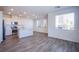 Open concept living area featuring the kitchen with an island and stainless steel appliances at 145 Aqua Commons Ln, Henderson, NV 89015
