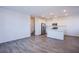 Spacious living room features an open concept and flows into a bright kitchen at 145 Aqua Commons Ln, Henderson, NV 89015