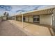 Spacious backyard featuring a covered patio, rock landscaping and a view of palm trees at 1491 Sunrise View Dr, Las Vegas, NV 89110