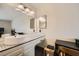This bathroom has a double sink with designer faucet, and a large mirror at 1491 Sunrise View Dr, Las Vegas, NV 89110