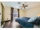 Bedroom featuring dark floors, neutral walls, and a large sliding mirror closet at 1491 Sunrise View Dr, Las Vegas, NV 89110
