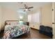 Bedroom featuring ceiling fan, light colored walls, dark floors and closet at 1491 Sunrise View Dr, Las Vegas, NV 89110