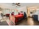 This bedroom features wood style floors, ceiling fan, sliding mirror closet doors and neutral paint at 1491 Sunrise View Dr, Las Vegas, NV 89110